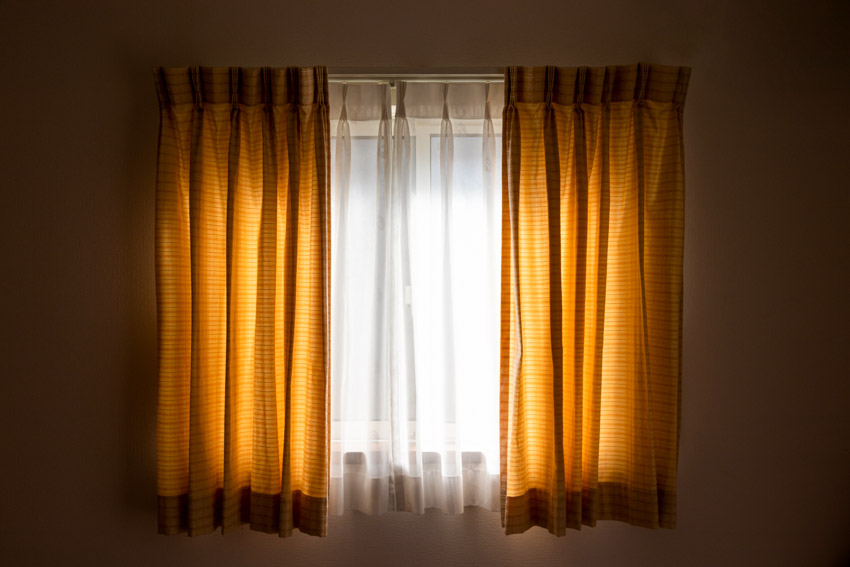 House interior window with curtain rod, and curtains