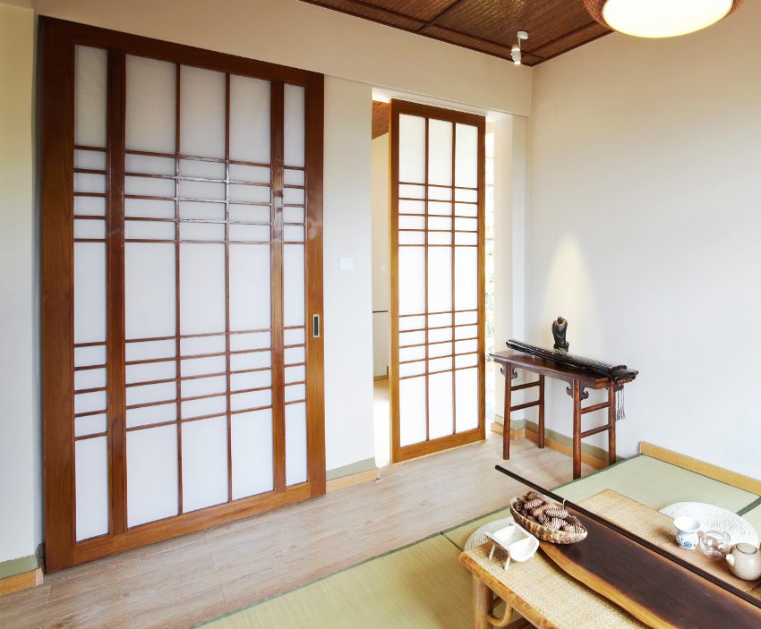 Japanese style private room with shoji doors and tea table with teapot and cups