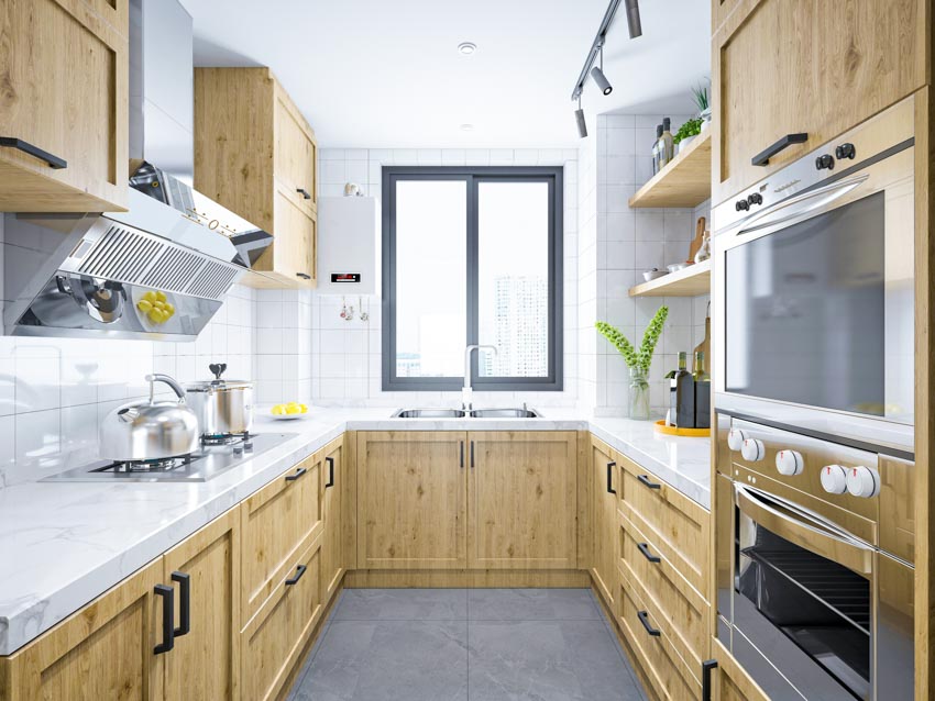 Kitchen with laminate countertops, window and bar lights