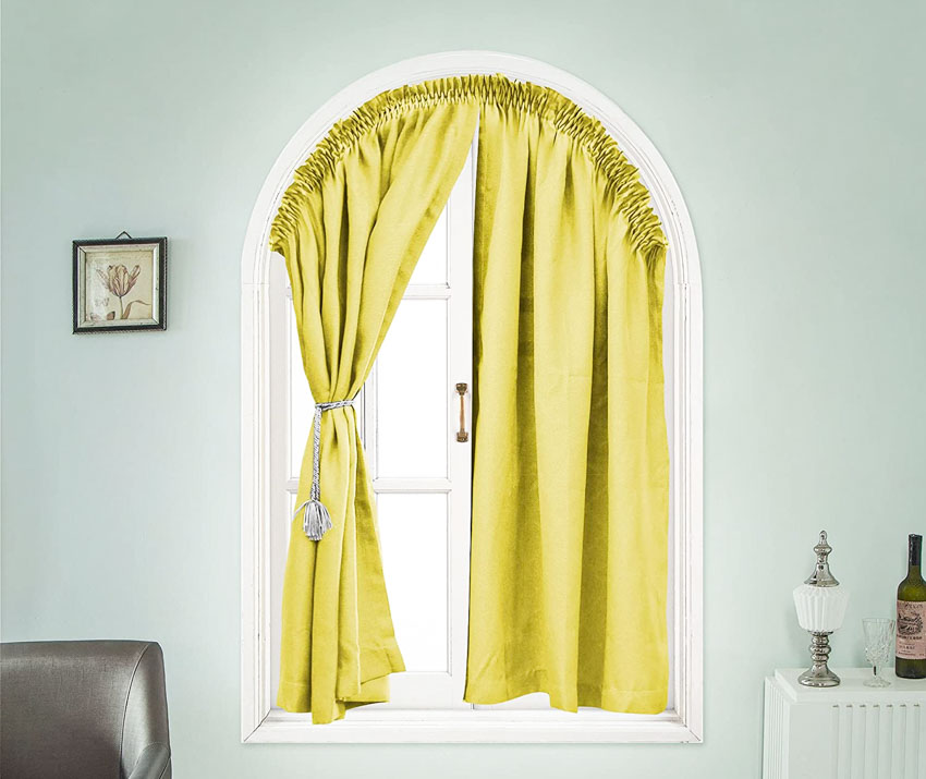Arched-style curtain with light green walls