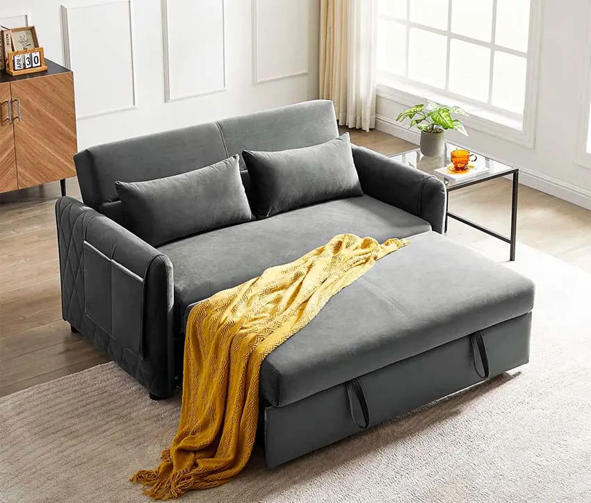 gray loveseat with yellow blanket