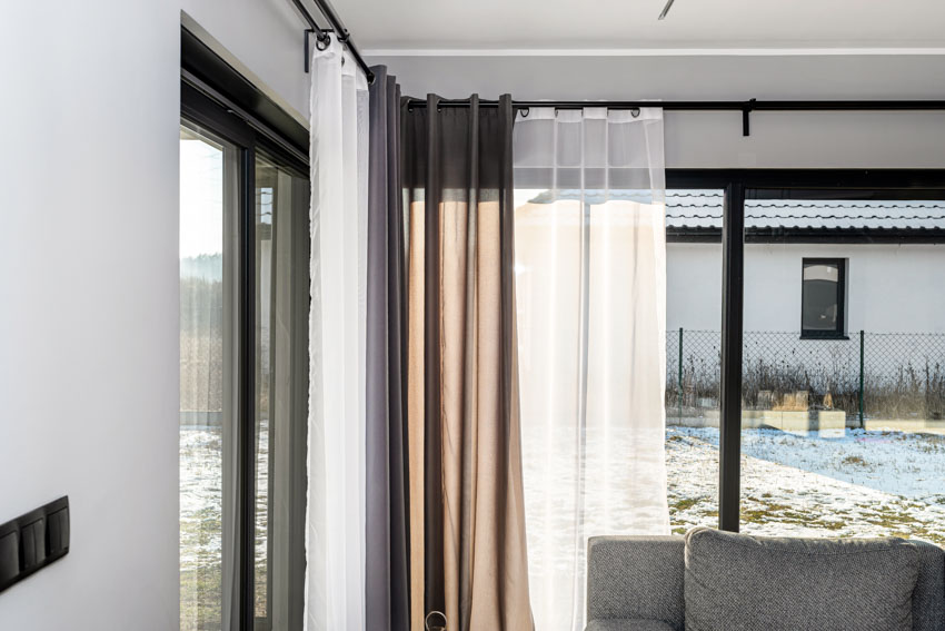 Corner curtains placed by the sliding glass windows