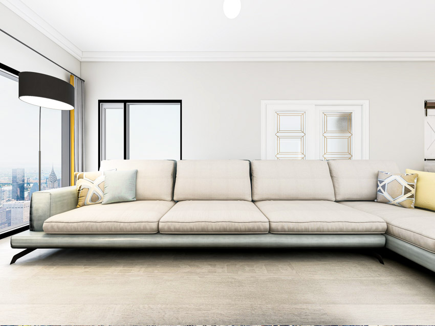 reclined white sofa with pillows
