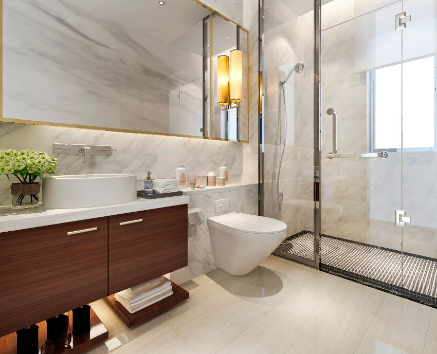 Lovely bathroom interior with vanity mirror, glass shower door, and large format tile in shower wall