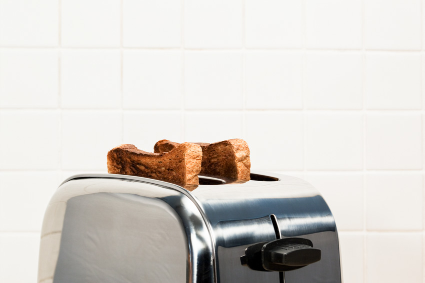 Metal toaster with bread in it