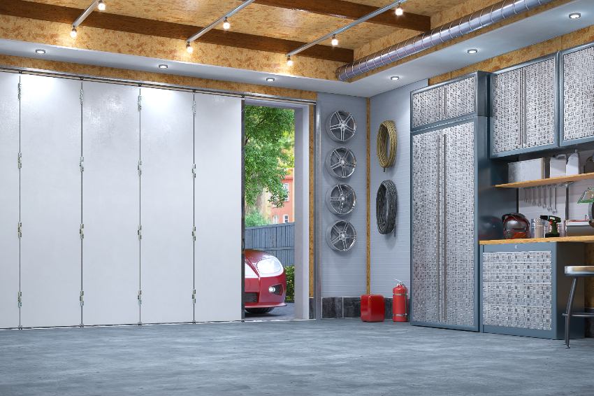Modern garage interior with sectional doors and insulator on ceiling