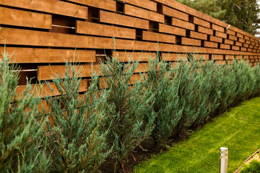 Modern horizontal designed fence made of wood blocks