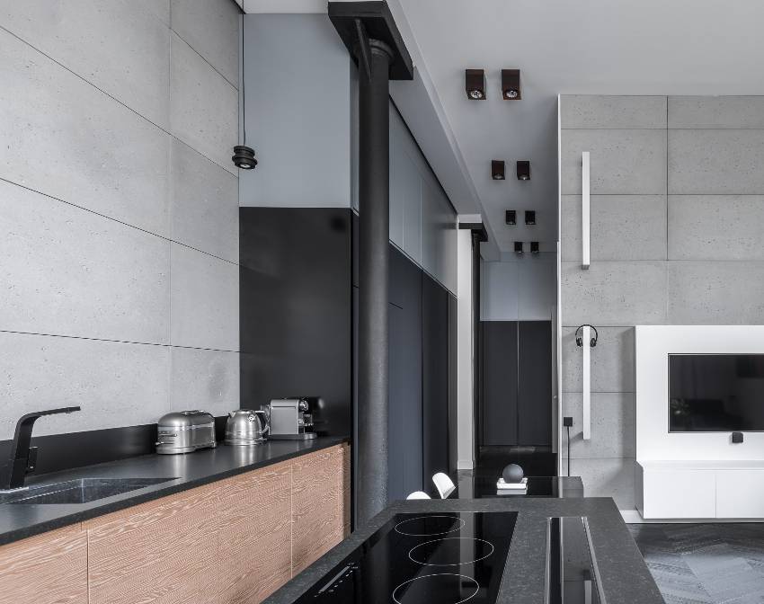 Open cooking area in modern kitchen with aesthetic concrete tile panels