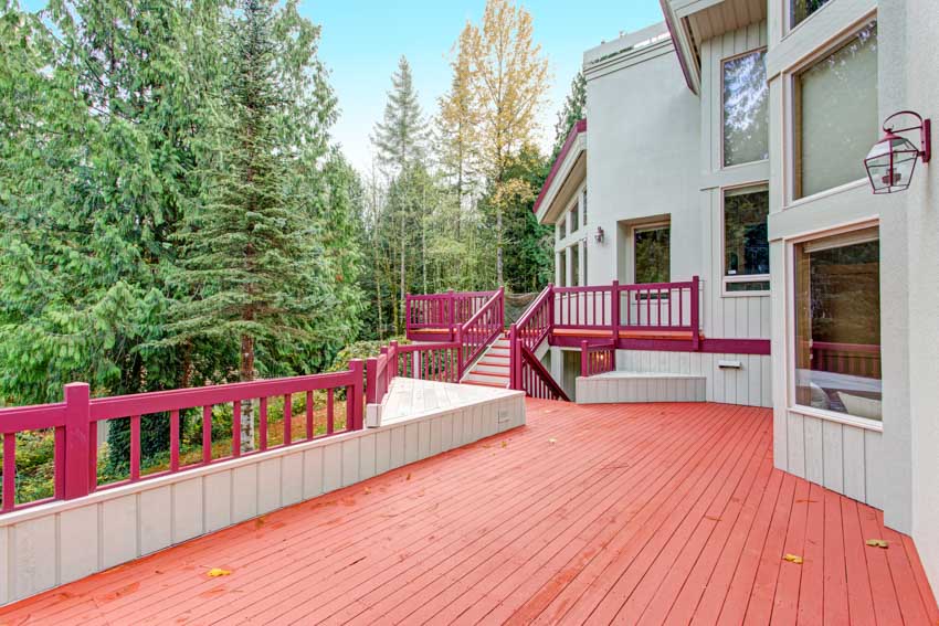 Outdoor area with railing windows, and painted redwood deck