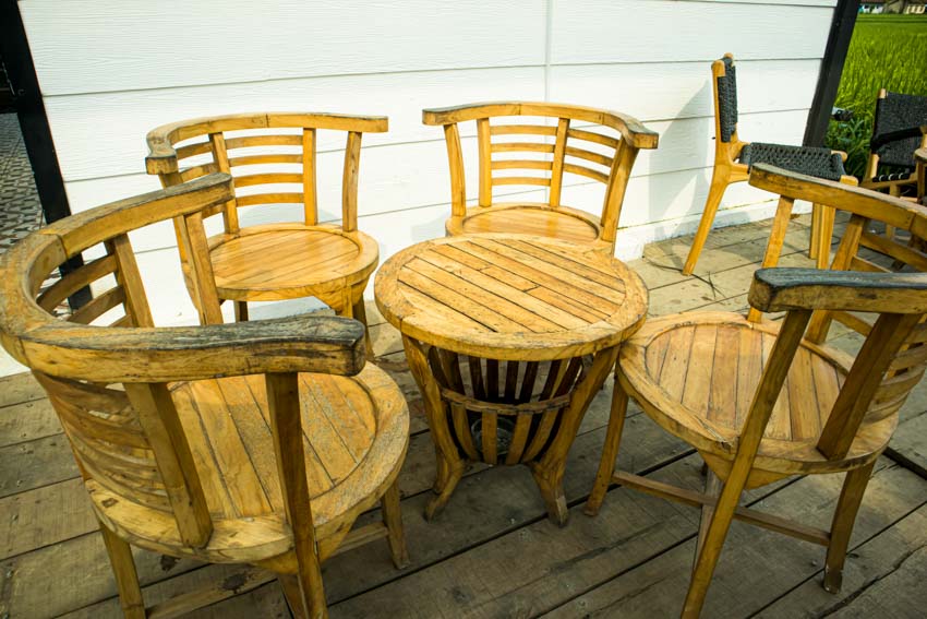 Outdoor deck with ladder back barrel chairs, and wood table