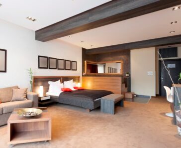Spacious Bedroom With Sofa Bed And Drywall Ceiling With Wooden Beams Is 364x297 