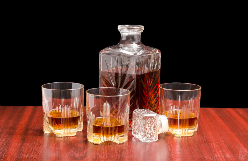 Square glass decanter with liquor in it