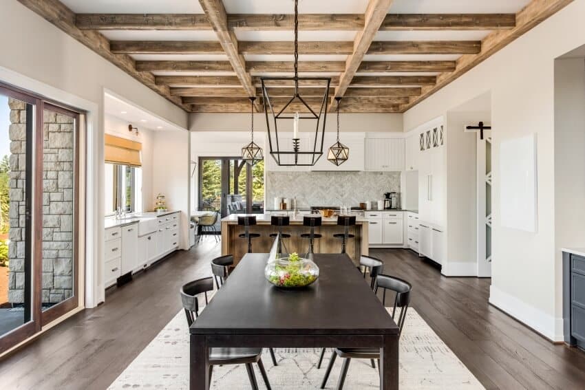 Stunning open plan dining room and kitchen with wood beams ceiling and elegant pendant lights accent
