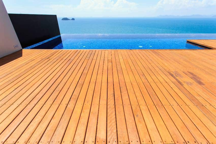 Teak wood decking on infinity pool with ocean view