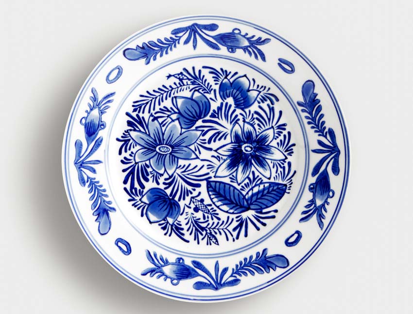 Tin glazed plate with blue flower details
