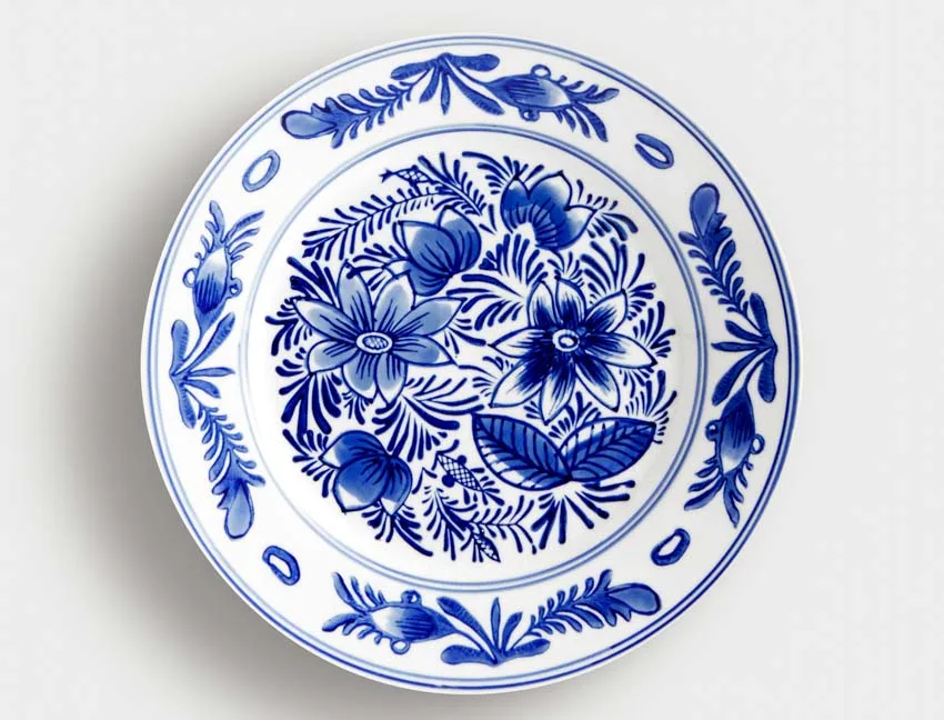 Tin glazed plate with blue flower details