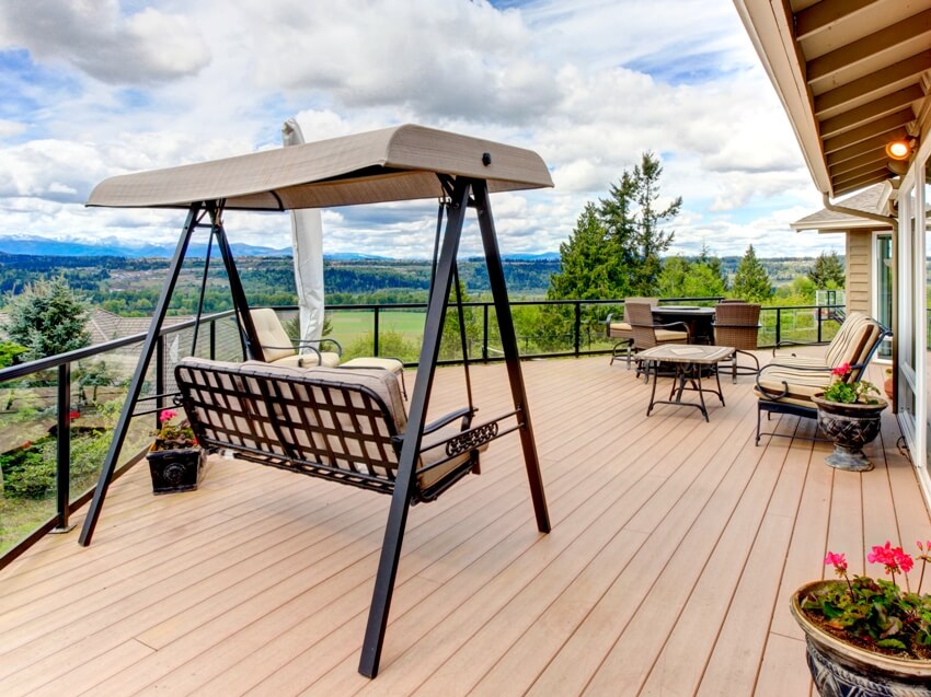 Untreated Douglas fir deck screened with fire pit, chais, bench garden swing and an amazing view of sky and greenland