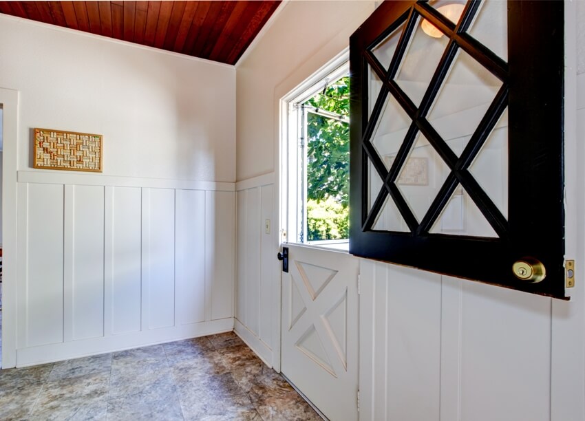 A white room interior with open dutch door