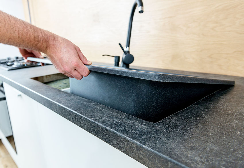 Installing sink over black granite countertop