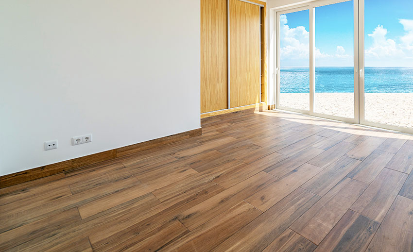 Ocean view bedroom with wood strip pattern flooring design