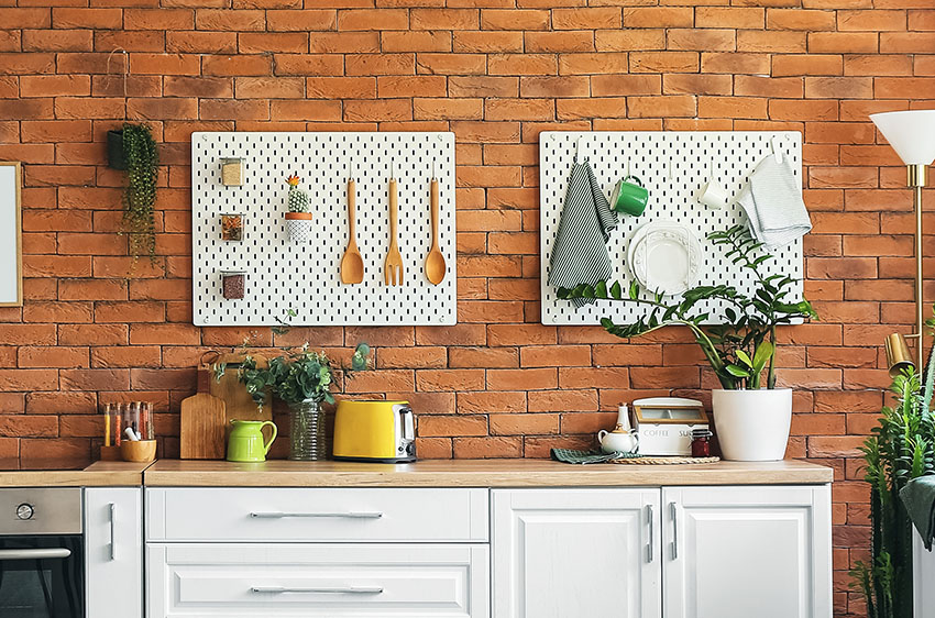 Pegboards brick wall white kitchen cabinet