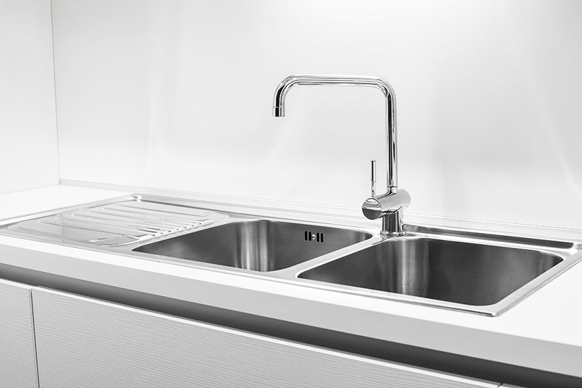 Stainless double basin kitchen sink with single handle faucet