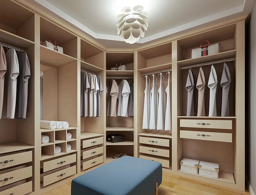 Walk-in closet with chandelier closet bench beige cabinet
