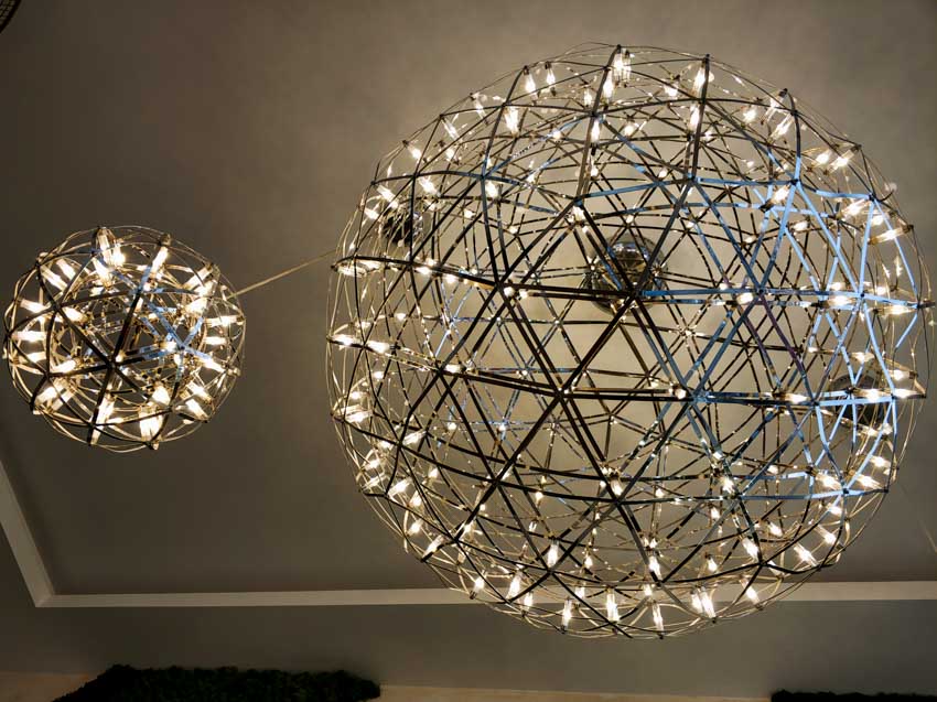 A pair of globe chandeliers for kitchens