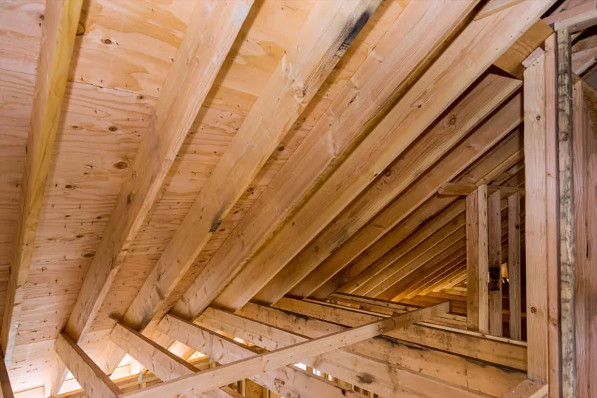 Beams and panels made of wood in the attic