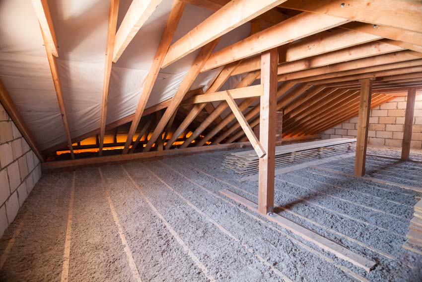 Attic crawl space with wood beams as support