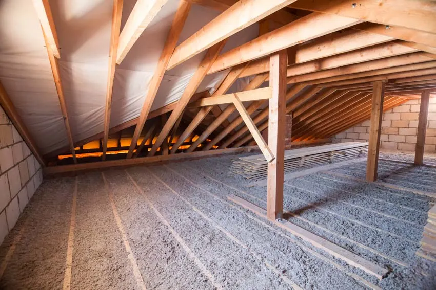 Attic crawl space with wooden support beams