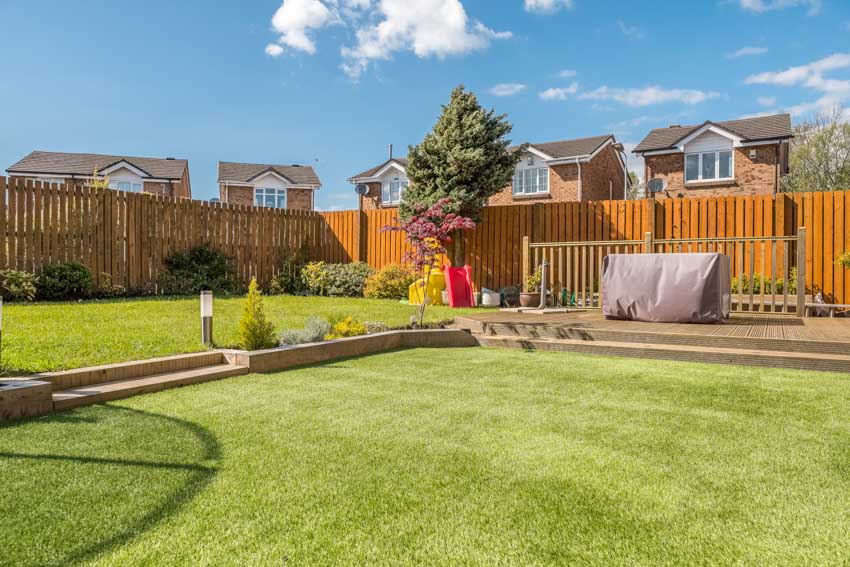 Backyard area with deck with trees