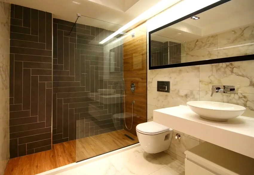Bathroom shower with warm lighting, laminate walls and glass division