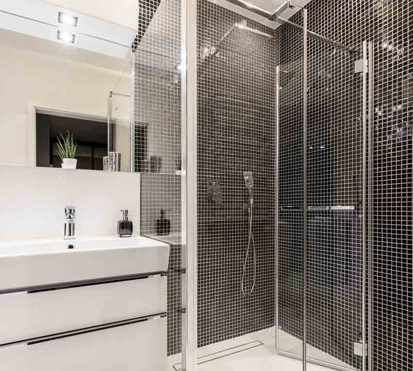 Black ceramic tiles, modular cabinets with wash basin