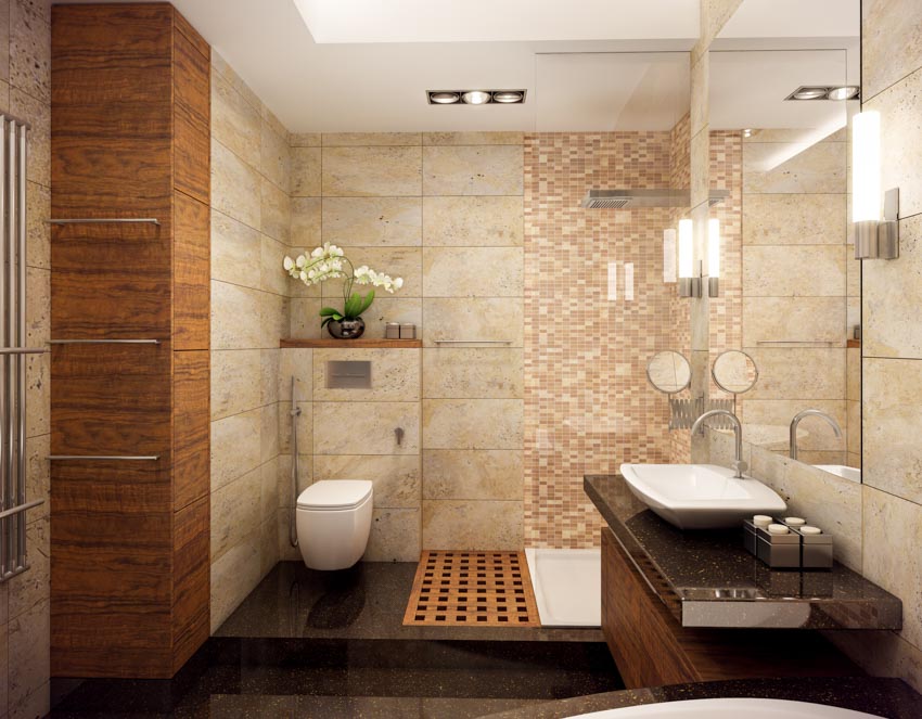 Bathroom with mosaic tile shower accents, toilet, vanity area, countertop, sink, mirror, and ceiling lights