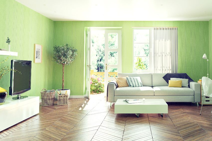 A beautiful living room interior design with lime green walls, wood floors, and white furnitures