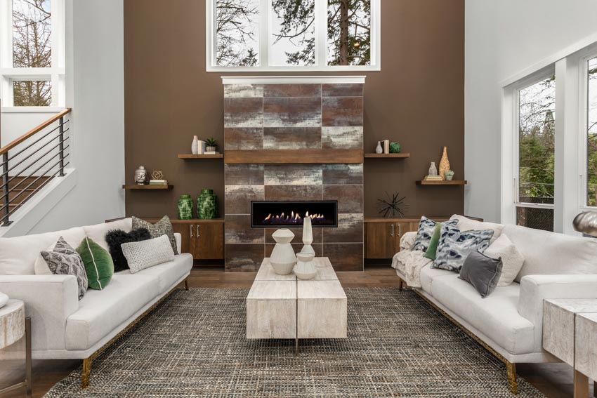 White living furniture set with pillows, geometric jars on floating shelving