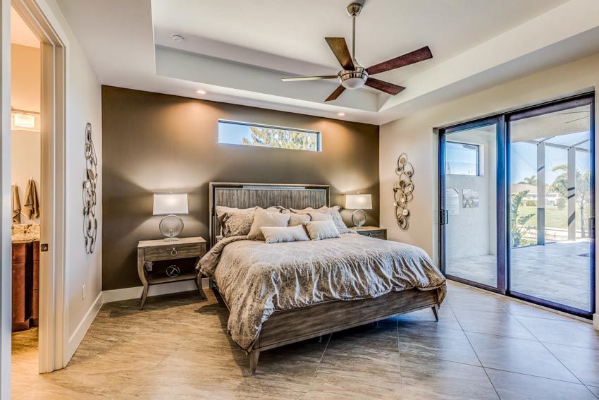 Brown fan with light in tray ceiling