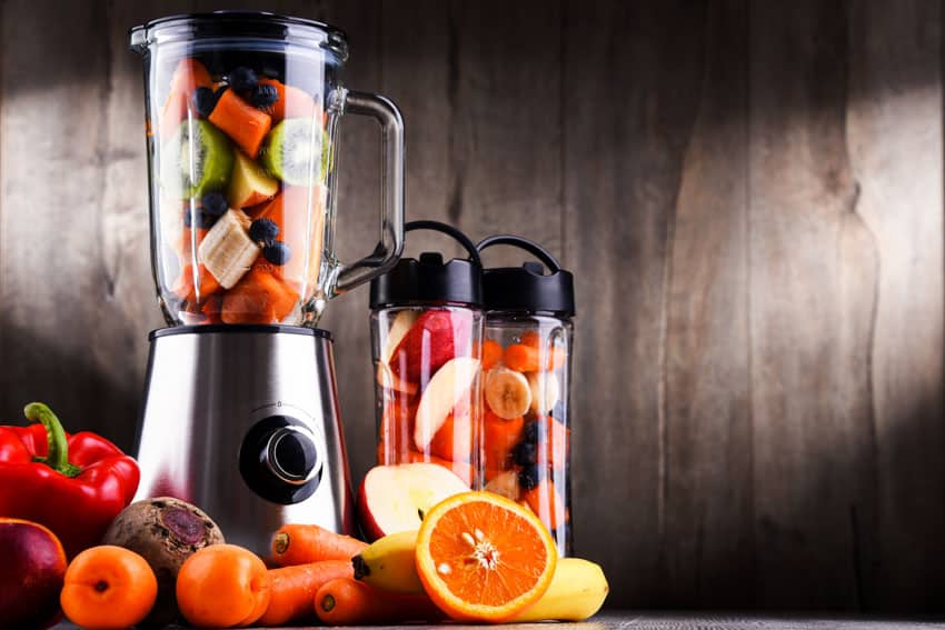 Blender full of various fruit slices