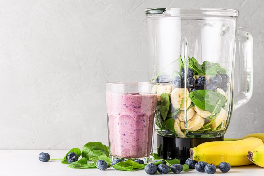 Blender with smoothie inside a glass for kitchens