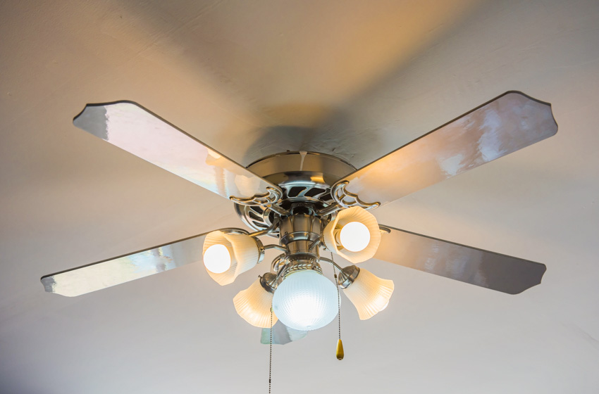 Ceiling fan with lighting fixtures and metal blades