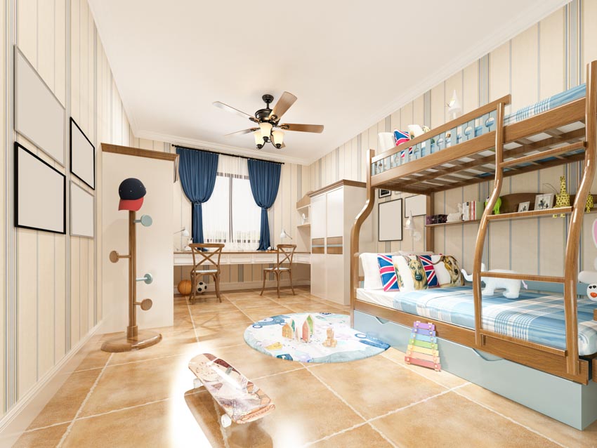 Children's bedroom with bunk bed, kid's ceiling fan, table, chairs, window, and tile flooring