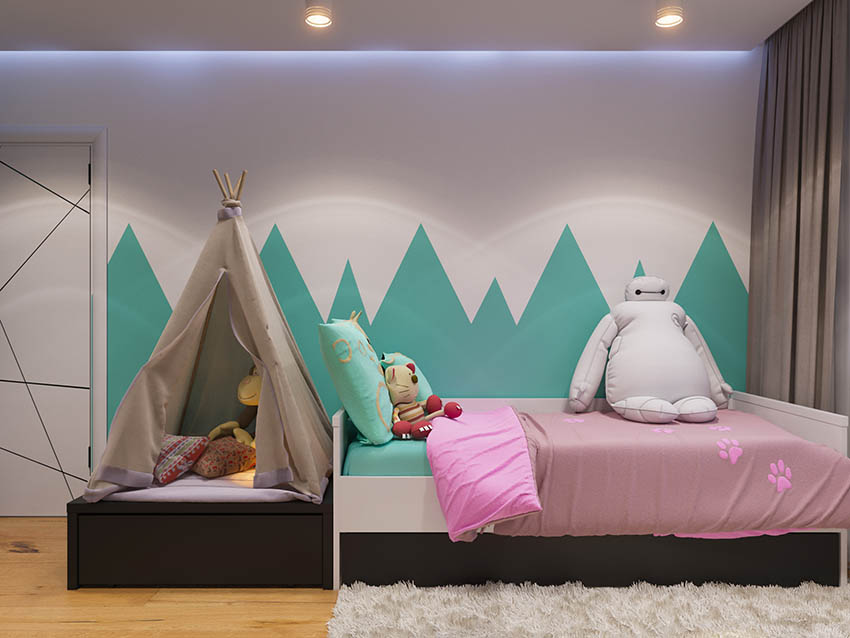 Child's bedroom with aqua stencil wall art pink bedspread
