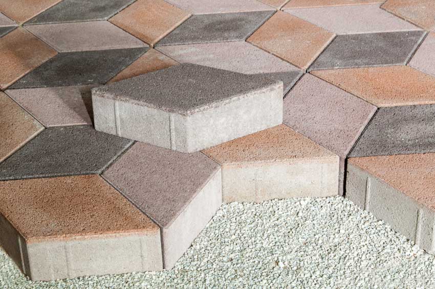 Crushed stone base with geometric pavers 