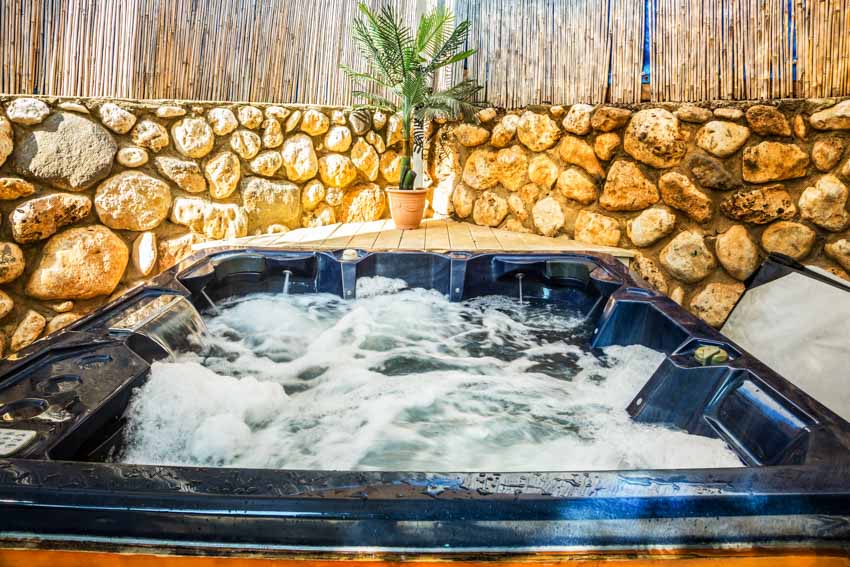 Faux stone wall for outdoor hot tubs