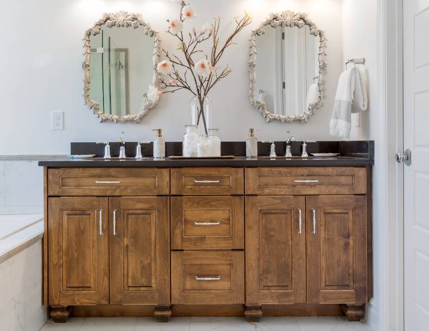 Gorgeous bathroom with double vanity accent and rustic cabinet paired with slab of absolute black granite countertop