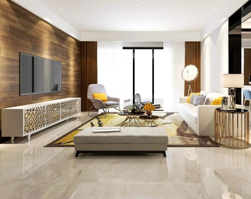 Gorgeous living room with white gray and gold furniture and marble floors with carpet