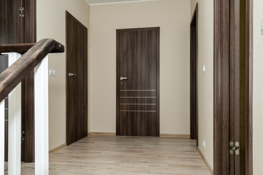 Hallway with wooden doors and flooring