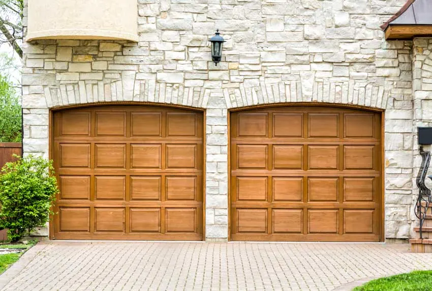 Quartzite siding as exterior of a garage with wooden doors