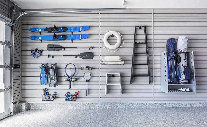 Horizontal slat wall with tools and equipment for garages